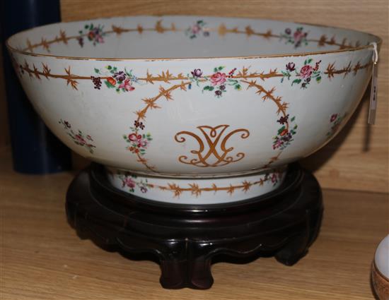 A 19th century Chinese export punch bowl (restored), on carved hardwood stand